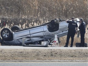 Windsor police officers investigate a serious roll-over accident on March 29, 2019, in the eastbound lanes of the EC Row Expressway. The accident occurred at approximately 3 p.m. Friday and resulted in the eastbound lanes being shut down between Central Avenue and Jefferson Blvd. for several hours.