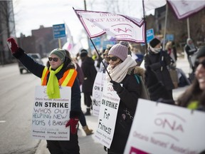 Public health nurses at the Windsor Essex County Health Unit, walk the picket line on Ouellette Ave. in front of the health unit on the first day of strike action, Friday, March 8,  2019.