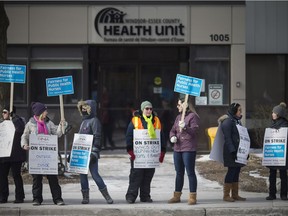 Public health nurses at the Windsor Essex County Health Unit, walk the picket line on Ouellette Avenue in front of the health unit on the first day of a strike, March 8,  2019.
