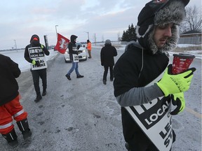 Part-time striking workers at the Atlas Tube Centre in Lakeshore briefly hold up traffic entering the facility March 6, 2019. They are members of IBEW Local 636.