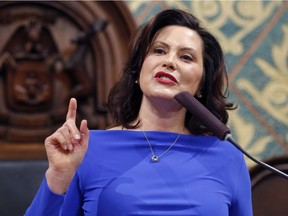 FILE - In this Feb. 12, 2019 file photo, Michigan Gov. Gretchen Whitmer delivers her State of the State address to a joint session of the House and Senate at the state Capitol in Lansing, Mich.