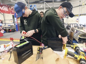 Forty teams representing 1,500 high school students from across Ontario are participating in the 6th annual Windsor Essex Great Lakes District FIRST Robotics competition, March 29 to 30, 2019, at the St. Denis Centre at the University of Windsor. Shown here on Day 1 are Oliver Francescutto, left, and Tyler Goulart from Chaminade College in North York doing some last-minute preparations during the event. Admission is free to the public on Saturday.