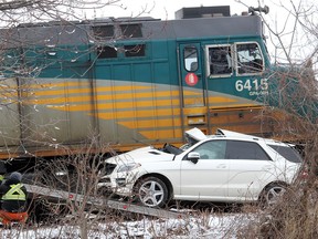 A vehicle involved in a crash with a Via Rail passenger train in Chatham, Ont. on Sunday March 31, 2019 is removed from the scene.
