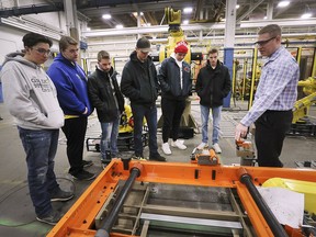 WINDSOR, ON. MARCH 5, 2019. --  Tom Harlow, a PLC manager with Valiant TMS in Windsor, ON. gives students from Essex High School a tour of the business on Tuesday, March 5, 2019. Valiant TMS was one of several local facility participating in Test Drive Day which connects students with skilled trades employers.