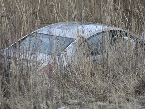 A car is shown in a ditch along Highway 3 west of Walker Rd. on March 20, 2019. Occupants of the car fled the scene leading to an extensive search of the area by OPP officers.