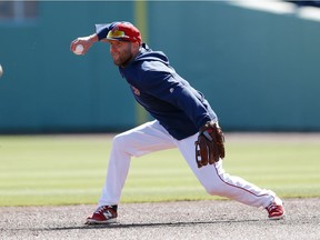 Boston Red Sox second baseman Dustin Pedroia takes infield practice before a spring training baseball game against the Minnesota Twins on March 7, 2019, in Fort Myers, Fla. Pedroia made his first start of the spring Thursday.