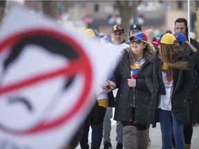 Local Venezuelans hold a rally at Jackson Park urging Canadians to support free and fair elections in Venezuela and the end of the regime of Nicolás Maduro, Saturday, March 2, 2019.