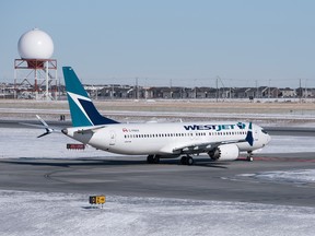 Westjet Boeing 737 MAX 8 prepares for takeoff at YYC Calgary International Airport in Calgary, Alta. on Monday, Feb. 26 2018.