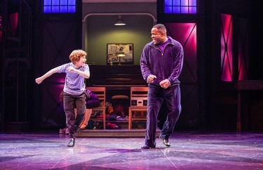 Nolen Dubuc (left) as Billy Elliot and Matthew G. Brown as Mr. Braithwaite perform the tap number We Were Born to Boogie in Billy Elliot the Musical.