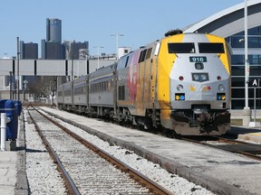 VIA Rail passenger train at Windsor's Walkerville Station bound for Toronto and points east Wednesday. Detroit's GM headquarters can be seen on the horizon, left.  Amtrak has asked the U.S, government to restore Toronto-Detroit train service after almost 50 years.
