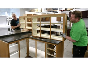 Rick Young, left, and Andrew Coughlin, both of Habitat for Humanity Windsor-Essex, in the kitchen department of their new ReStore location at 57 Edinborough Street Friday.  Habitat for Humanity Windsor-Essex received a $723,000 Ontario Trillium Foundation grant to expand the kitchen and appliance recycling initiatives.