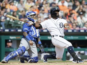 Christin Stewart of the Detroit Tigers, right, watches his seventh inning grand slam with catcher Martin Maldonado of the Kansas City Royals at Comerica Park on April 6, 2019 in Detroit, Michigan. The Tigers defeated the Royals 7-4.
