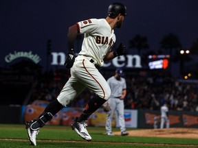 Kevin Pillar of the San Francisco Giants rounds the bases after hitting a grand slam home run off of Eric Lauer of the San Diego Padres during the fourth inning at Oracle Park on April 8, 2019 in San Francisco, California. The San Diego Padres defeated the San Francisco Giants 6-5.