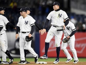 NEW YORK, NEW YORK - APRIL 01: Mike Tauchman #39 and Aaron Judge #99 of the New York Yankees celebrate after winning 3-1 in the game against the Detroit Tigers at Yankee Stadium on April 01, 2019 in the Bronx borough of New York City.