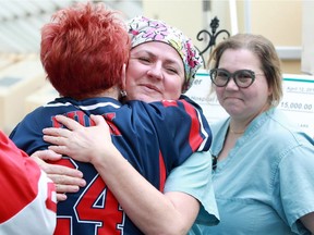 Operating room RNs Trish Parker, centre, and Irene Trajkovski, right, give warm hugs to Judy Funkenhauser, left, during the Team Spirit Approach to Organ and Tissue Donation event at Windsor Regional Hospital's Ouellette campus on April 12, 2019.  Funkenhauser and her husband Gunther were on hand to deliver a $15,000 donation to Windsor Regional Hospital Foundation, proceeds from their annual A Day For A Life golf tournament held in honour of their son, Trevor Louis Funkenhauser, who saved three lives with his gifts of life. This year's A Day For A Life golf tournament is June 19, 2019.