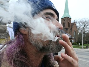 Ian Morris, 53, of Windsor on the University Avenue East sidewalk outside Epic 420 Festival in downtown Windsor Friday.