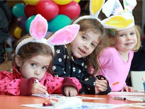 Ellis McKee, 2, left, Adalyn Mckee, 7, and Layla Lauzon, 2, wear their bunny ears proudly while colouring at Windsor Family Credit Union's Easter Egg Drop held inside the Vollmer Complex in LaSalle on  Saturday April 20, 2019.
