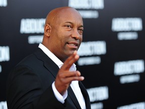 (FILES) In this file photo taken on September 15, 2011 Director John Singleton arrives for the world premiere of "Abduction" at Grauman's Chinese Theatre in Hollywood. - Director John Singleton, 51, has been hospitalized in the intensive care unit after he suffered a stroke this past Wednesday, his family said Saturday April 20, 2019.