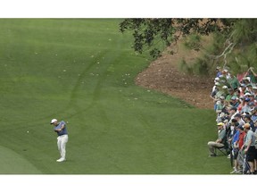 Francesco Molinari, of Italy, hits a shot on the 10th hole during the second round for the Masters golf tournament Friday, April 12, 2019, in Augusta, Ga.