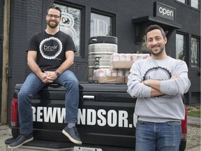Brothers Jordan Goure, left, and Josh Goure, co-owners of Brew Micro Brewery, are picture with their delivery vehicle outside their brewery, Friday, April 26, 2019.  Today is the first day brew delivery will be available to order online.