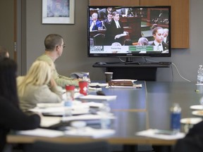 Local labour leaders, including Brian Hogan, left, president of the Windsor and District Labour Council, watch as the Ontario government unveils the 2019 Ontario budget, Thursday, April 11, 2019.