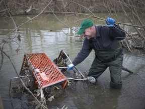 Dan St. Denis, an employee with Caesars Windsor, hauls a shopping cart out of the Little River in Forest Glade during Caesars Windsor Code Green, Tuesday, April 2, 2019.  The annual cleanup is in partnership with the Detroit River Canadian Cleanup, the Little River Enhancement Group, Essex Region Conservation, and the City of Windsor.  Approximately 25 people showed up to volunteer their time.