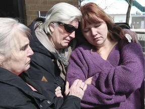 Family members of murder victim Scott Phillips are shown outside of the Windsor Superior Court building on Tuesday, April 2, 2019, following the sentencing of Daniel Shaw, the last of six co-accused who pleaded guilty to their involvement in the kidnap and torture case. Scott's mother Sue Phillips, second from left, is shown with her sister Julie Miller, left, and Miller's daughter Amanda Marion.