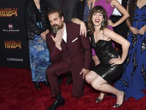 Actors David Harbour, left, and Milla Jovovich pose together at a special screening of "Hellboy" at AMC Lincoln Square on Tuesday, April 9, 2019, in New York. (Evan Agostini/Invision/AP)