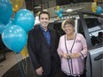 Steve Govette, left, manager of housing and facility services at Canadian Mental Health Association Windsor-Essex County, and Gale Simko-Hatfield, president of Do Good Divas, are pictured in front a 2019 Dodge Grand Caravan, Friday, April 26, 2019.   The Caravan, built at Windsor Assembly Plant, was donated to CMHA by the Do Good Divas.
