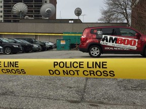 Windsor police tape at the rear parking lot of the Bell Media Radio building in the 1600 block of Dufferin Place on April 17, 2019.