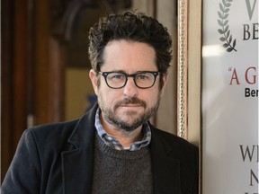 FILE - In this March 2, 2017 file photo, director-producer J.J. Abrams poses for a portrait to promote "The Play That Goes Wrong" at the Lyceum Theatre in New York. Abrams is returning to "Star Wars," and will replace Colin Trevorrow as writer and director of "Episode IX." Disney announced Abrams return on Tuesday, Sept. 12.