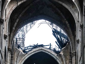 Daylight shines through the fallen roof structure of Notre Dame Cathedral following the fire in Paris, France, on Tuesday, April 16, 2019.