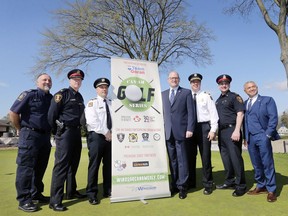 Paul Susko, left, Canada Border Services Agency, Supt. Frank Providenti, Windsor Police, Chief Stephen Laforet, Windsor Fire, Mayor Drew Dilkens, Deputy Chief Jamie Waffle, Windsor Fire, Insp. Jason Bellaire, Windsor Police and Goran Todorovic, Team Goran Realty pose for a photo at a press conference at the Roseland Golf Club on Tuesday, April 23, 2019 where an announcement was made regarding a partnership between the Can-Am Golf Series and the Canadian Mental Health Association.