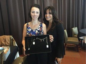 Dawn Sobol, who is battling Hodgkin's Lymphoma, is an ambassador for the upcoming Lock Out Cancer fundraising campaign. She is with Houida Kassem, executive director of the cancer foundation, as they show off jewelry which will be for sale during the month of May to support the campaign.