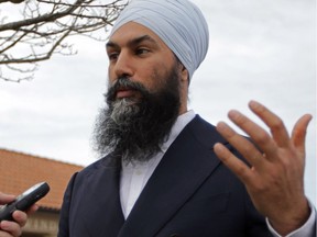 NDP Leader Jagmeet Singh speaks with a reporter outside the Fogolar Furlan Club in Windsor Saturday, April 13, 2019. While in town, Singh called for a national auto policy.
