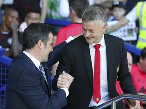 Everton manager Marco Silva, left, and Manchester United Manager Ole Gunnar Solskjaer shake hands ahead of the English Premier League soccer match at Goodison Park, Liverpool, England, Sunday April 21, 2019.