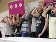 WINDSOR, ON. Sunday, April 14, 2019 -- A line of mothers race to drink water from baby bottles in a competition for a makeover during the fifth annual Mama Expo and Fam Jam at the Caboto Club in Windsor on Sunday, April 14, 2019.