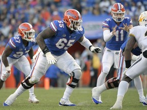 FILE - In this Nov. 3, 2018, file photo, Florida offensive lineman Jawaan Taylor (65) sets up to block at the line of scrimmage during the second half of an NCAA college football game against Missouri, in Gainesville, Fla. Taylor is a possible pick in the 2019 NFL Draft.