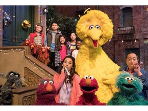 This image released by HBO shows the cast of the popular children's show "Sesame Street." Big Bird, Elmo and stars of "Sesame Street" are leaving their quiet neighborhood and hitting the road. The non-profit Sesame Workshop said Tuesday a selection of Muppets will embark on a 10-city trip to celebrate the show's 50th anniversary campaign with free park festivals, live performances and kid-friendly activities. (HBO via AP)