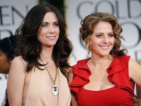 FILE - This Jan. 15, 2012 file photo shows Kristen Wiig, left, and Annie Mumolo at the 69th Annual Golden Globe Awards in Los Angeles. "Bridesmaids" writers Wiig and Mumolo are reuniting, eight years after their smash hit comedy. Lionsgate announced Wednesday, April 17, 2019, that it will produce "Barb and Star Go to Vista Del Mar" from a script by the pair. They will each also co-star in the film as best friends who leave their Midwestern town for a vacation in Florida.