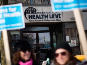 Striking members of Ontario Nurses' Association Local 8 picket in front of the Windsor-Essex County Health Unit offices on March 8, 2019.