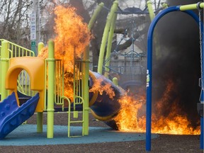 The playground equipment at the Dawson Road Playground, seen on fire Wednesday, April 10, 2019, was suspiciously set.  Playground equipment at Francois Court Park, four streets away, was also set on fire minutes earlier.