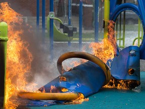 Playground equipment burns at the Dawson Road Playground in Windsor's east end on the evening of April 10, 2019.