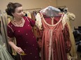 Lucinda Morris, a Quester in the Talbot Trail chapter who collects historical and ethnic clothes, holds a dress from the baroque period, circa 1600's, while at Caesars Windsor on April 29, 2019.