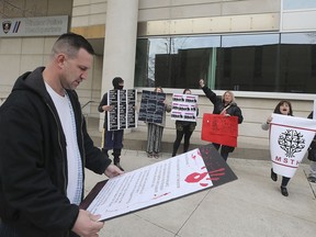 Brandon Bailey, a member of the Windsor Overdose Prevention Society and others rally in front of the Windsor Police Headquarters on Tuesday, April 16, 2019, in conjunction with the National Day of Action on the Overdose Crisis.