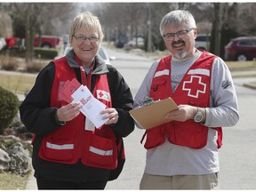 Canadian Red Cross volunteers Sharon Jolie and George Rudanycz are shown on Bellagio Dr. in Windsor, ON. on Tuesday, April 2, 2019. They were going door to door in the area as part of a pilot project to help people find new or more ways to reduce their flood damage risk.