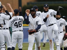 Detroit Tigers' Niko Goodrum leads the team in celebration after their 5-4 win over the Kansas City Royals in the Tigers' home opener baseball game on Thursday, April 4, 2019, in Detroit.
