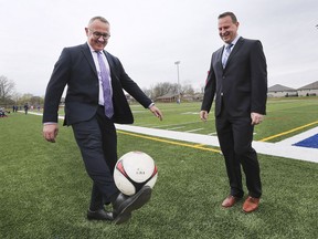 Terry Lyons, left, Director of Education for the Windsor Essex Catholic District School Board demonstrates some soccer skills to Egidio Mosca, President, Giovanni Caboto Soccer Club during a press conference on Thursday, April 25, 2019, at Holy Names Catholic High School.