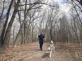 Don Malo walks his dog Max at the Spring Garden Natural Area in Windsor on Tuesday, April 23, 2019.