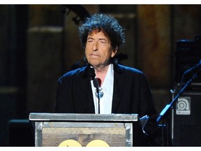 FILE - In this Feb. 6, 2015 file photo, Bob Dylan accepts the 2015 MusiCares Person of the Year award at the 2015 MusiCares Person of the Year show in Los Angeles. Dylan is set to help open a whiskey distillery in fall 2020 under the brand "Heaven's Door."